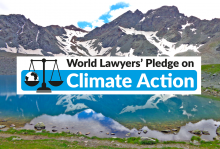 climate pledge logo on a background of mountains and lake
