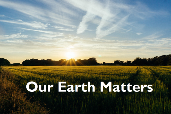 Sunset over a countryside scene with blue sky and text spelling: Our Earth Matters
